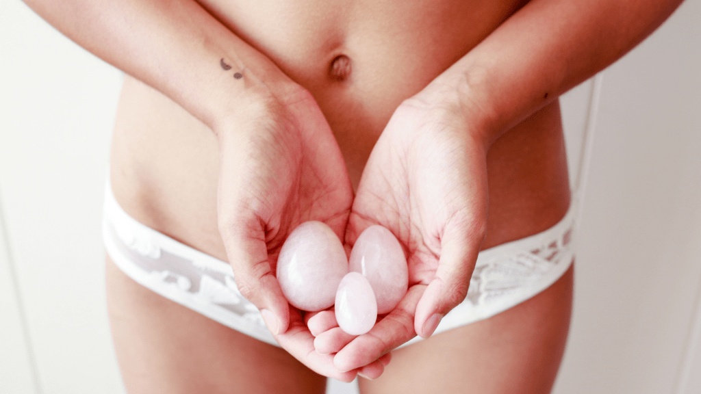Sexy woman in white with Rose Quartz Yoni Egg
